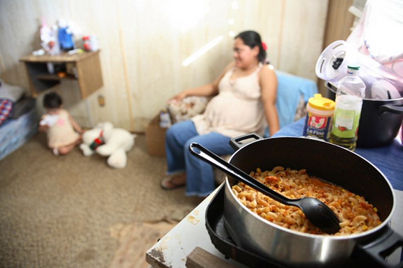 At home with Rosa and her children.  Grocery essentials were donated by a Holy Family social worker. 1img_2426