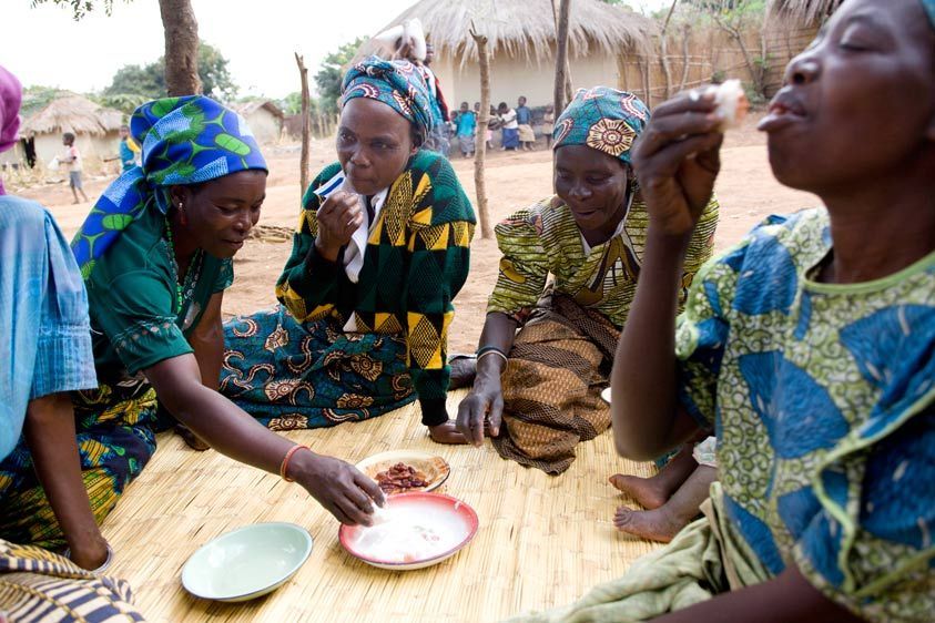 The Namirzi group shares a meal before going out to the fields. Like Family