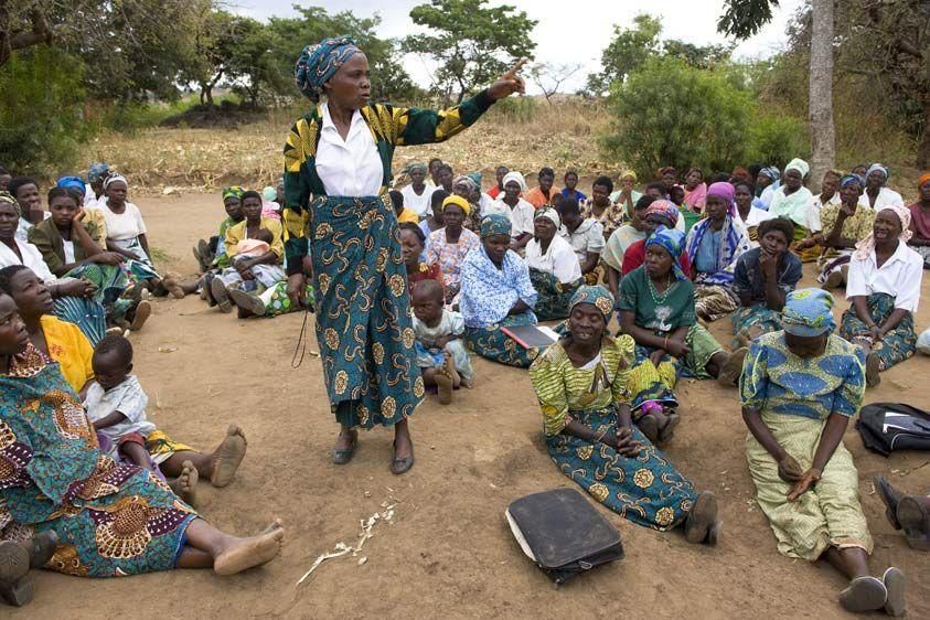 Elise tells her peers in the Kaundama village how the VSL program has transformed her life. 'If I reach something on my own, I will not have peace, because I am only one. But together, 11 households will be better off. The whole community will benefit from our business.' VSL General Meeting
