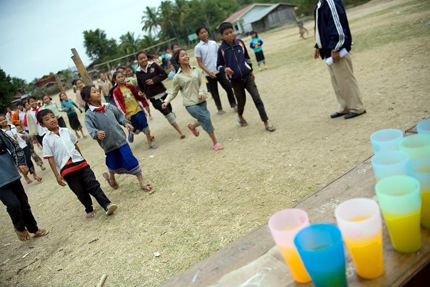 Fresh juice is served after the games. Many children in rural Laos suffer from poor nutrition. Refreshments