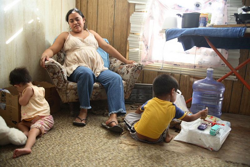 Rosa and her family live in one room of a trailer sectioned off for four families.  Her husband abandoned them and she is unable to work. 1img_2409