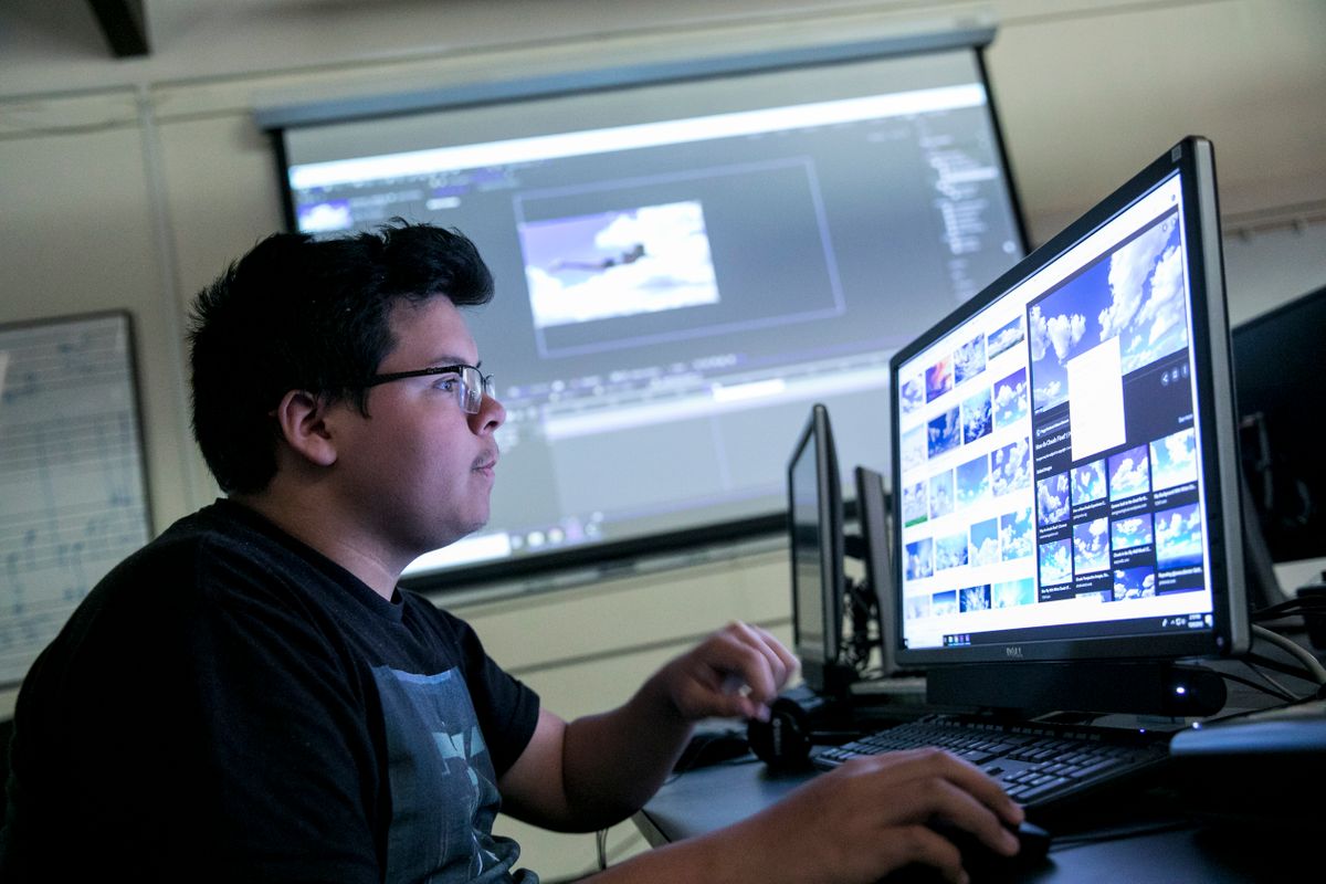 Art student works on photo composite in the lab