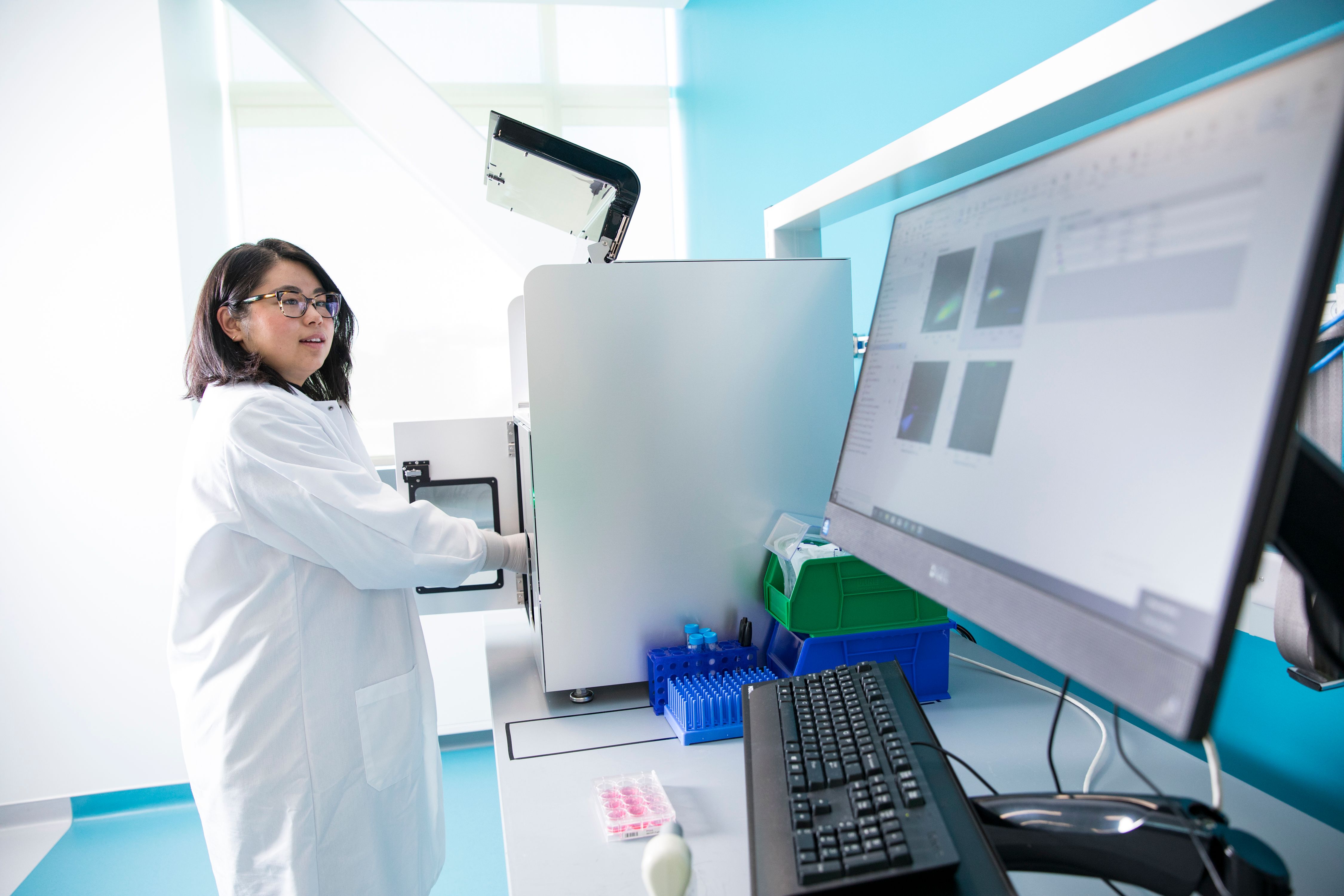 Asian woman in light laboratory
