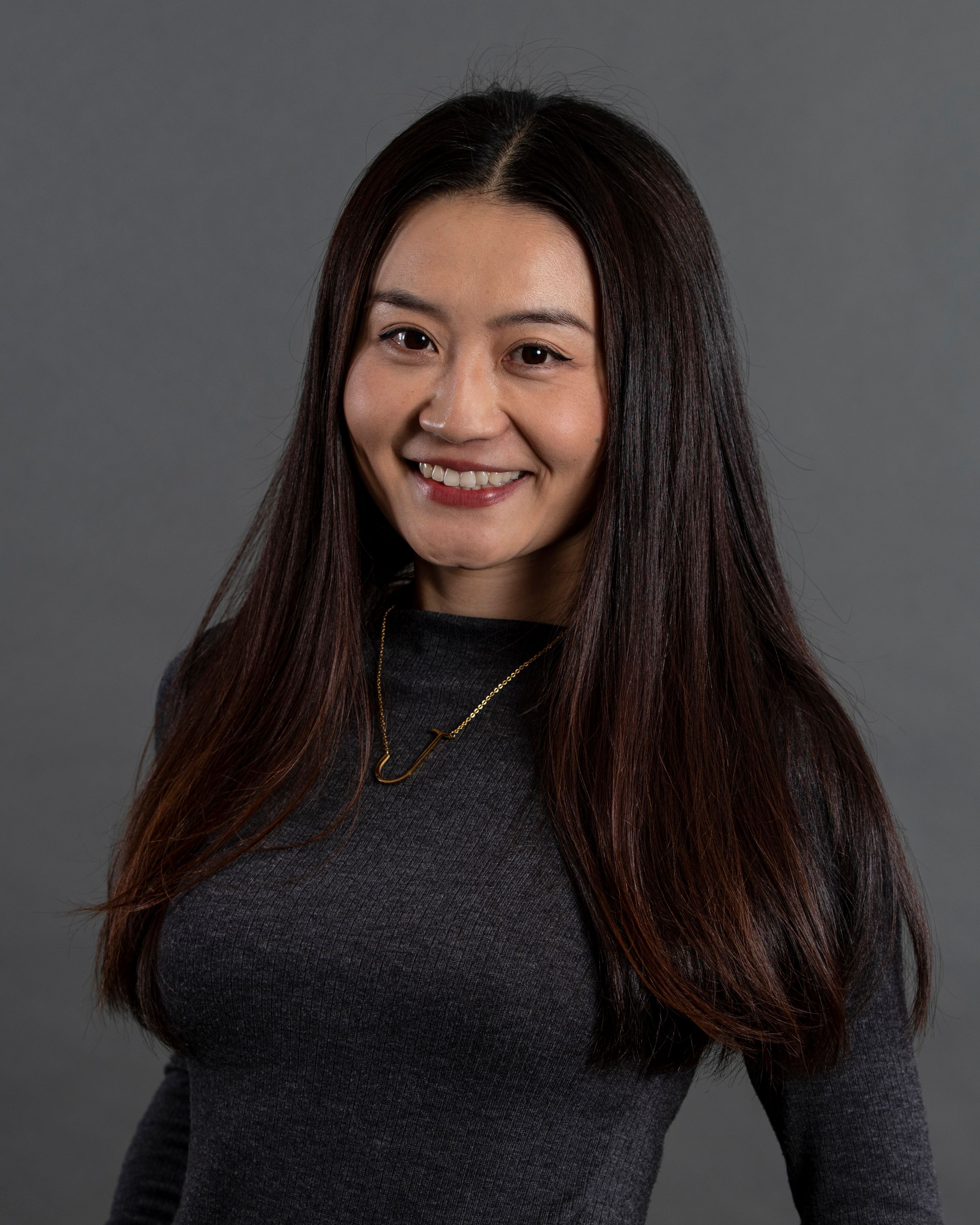 Asian woman with gray sweater