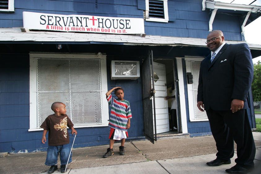 Rev. Kyev Tatum talks to neighborhood kids after school After School