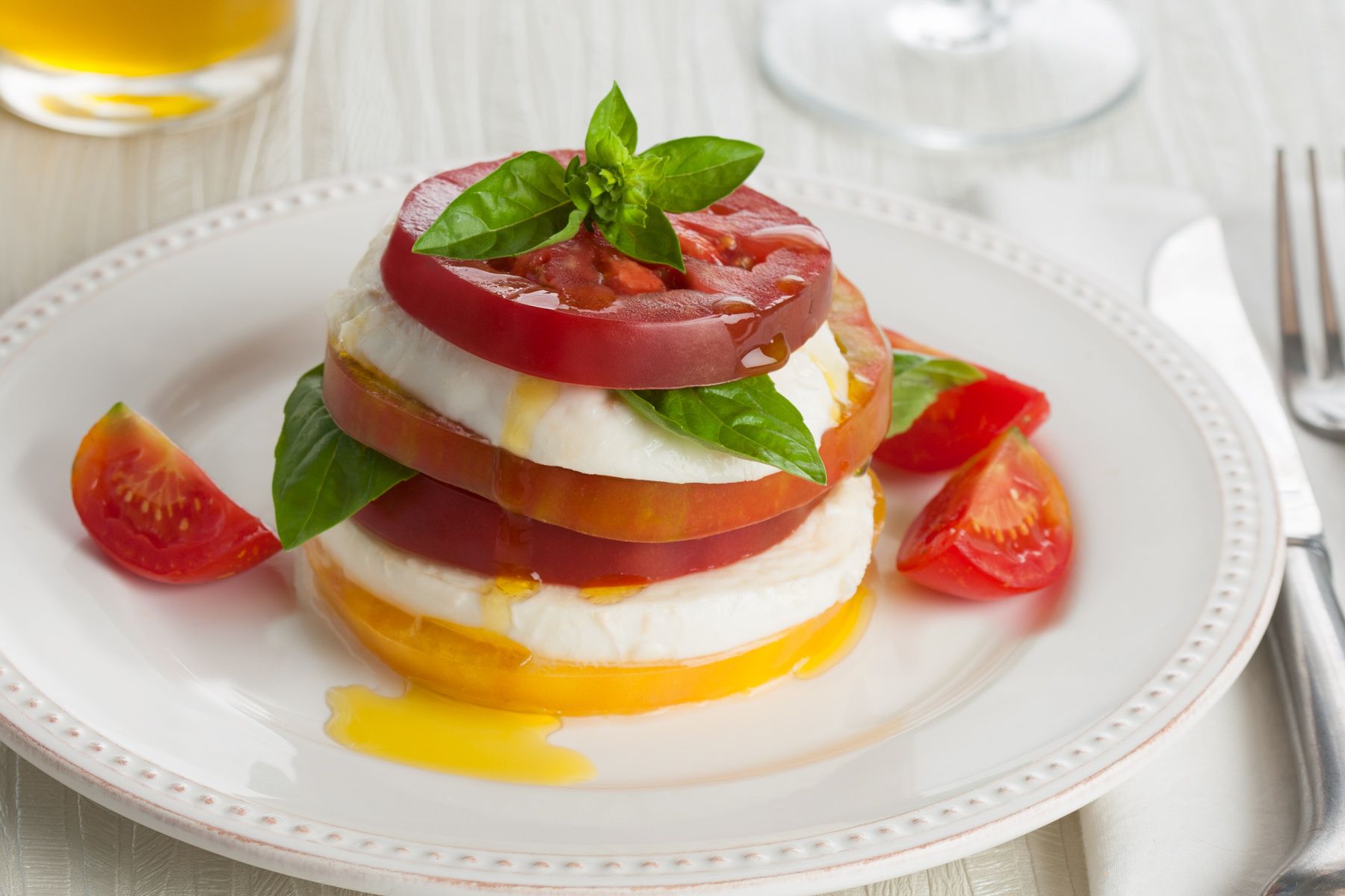 featuring fresh heirloom tomatoes, buffalo mozzarella and organic basil caprese salad