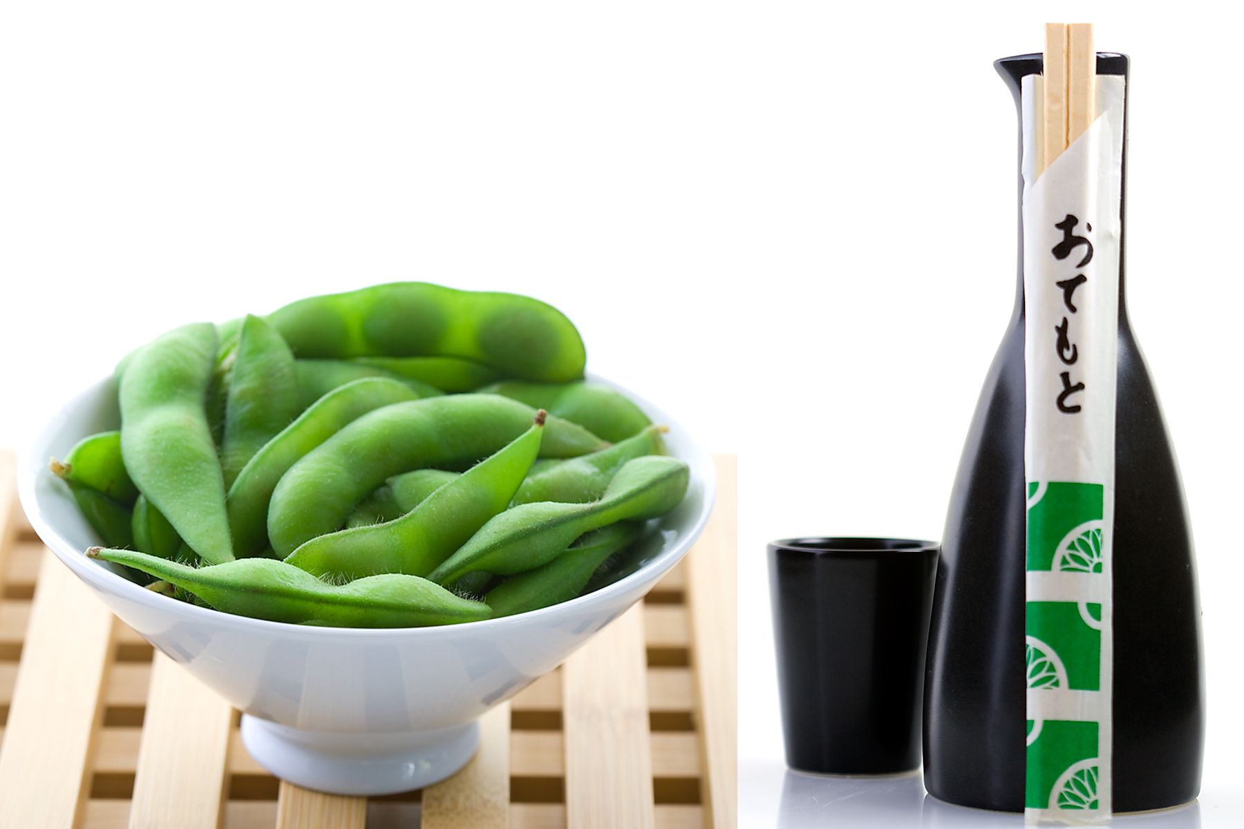 bowl of edamame and saki with chopsticks