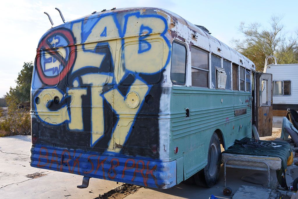 Welcome to Slab City. It's 'off the grid': there's no running water - it all has to be trucked in; solar panels are used to collect energy from the sun; there is no sewage treatment - think outhouses; and summer temperatures can reach as high as 128° F.