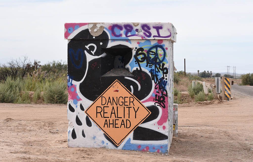 'DANGER - REALITY AHEAD'Leaving Slab City: 'Babylon' lies ahead once you cross the railroad tracks.