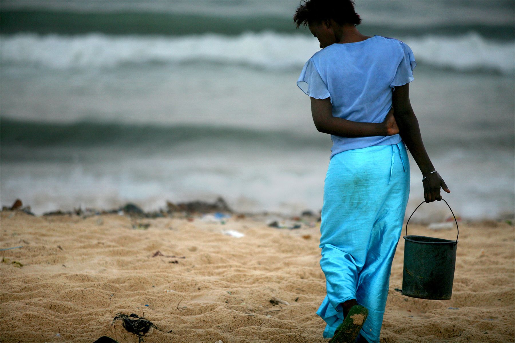 SENEGALESE GIRL IN TURQUOISE SKIRT