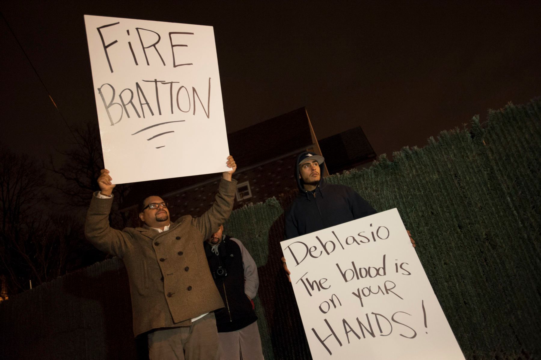 12/03/2014: Outside Mt. Sinai Church in Staten Island, two protesters held signs, meant for Mayor Bill De Blasio. The Mayor gave a long speach at Mt. Sinai directly after the Grand Jury Decision, call for peaceful and meaningful protests. 1garnerdeblasio13