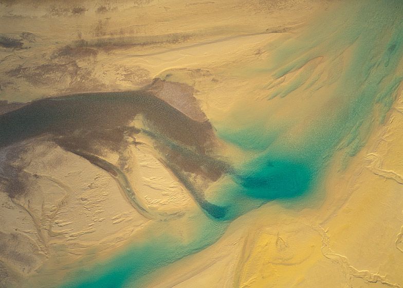 MELTWATER FLOWING OVER GOLDEN SAND AND SILT BARS, BAFFIN ISLANDS, 1994  BUY THIS PRINT