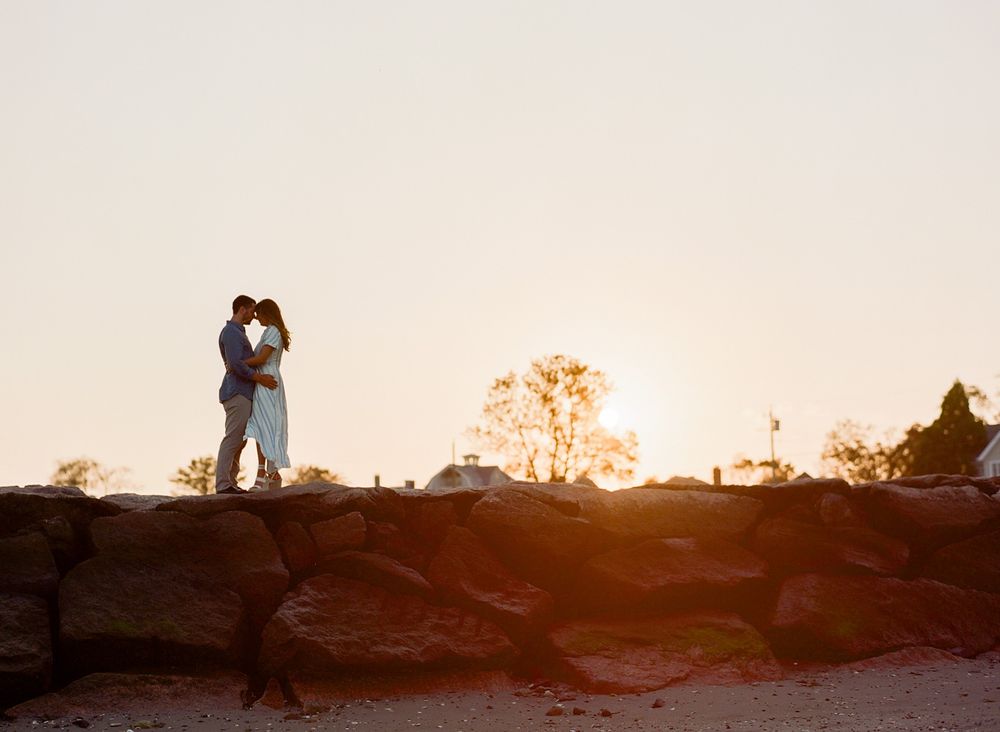 Couple on rocks at sunset