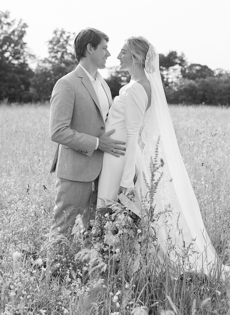 Couple kissing in a field