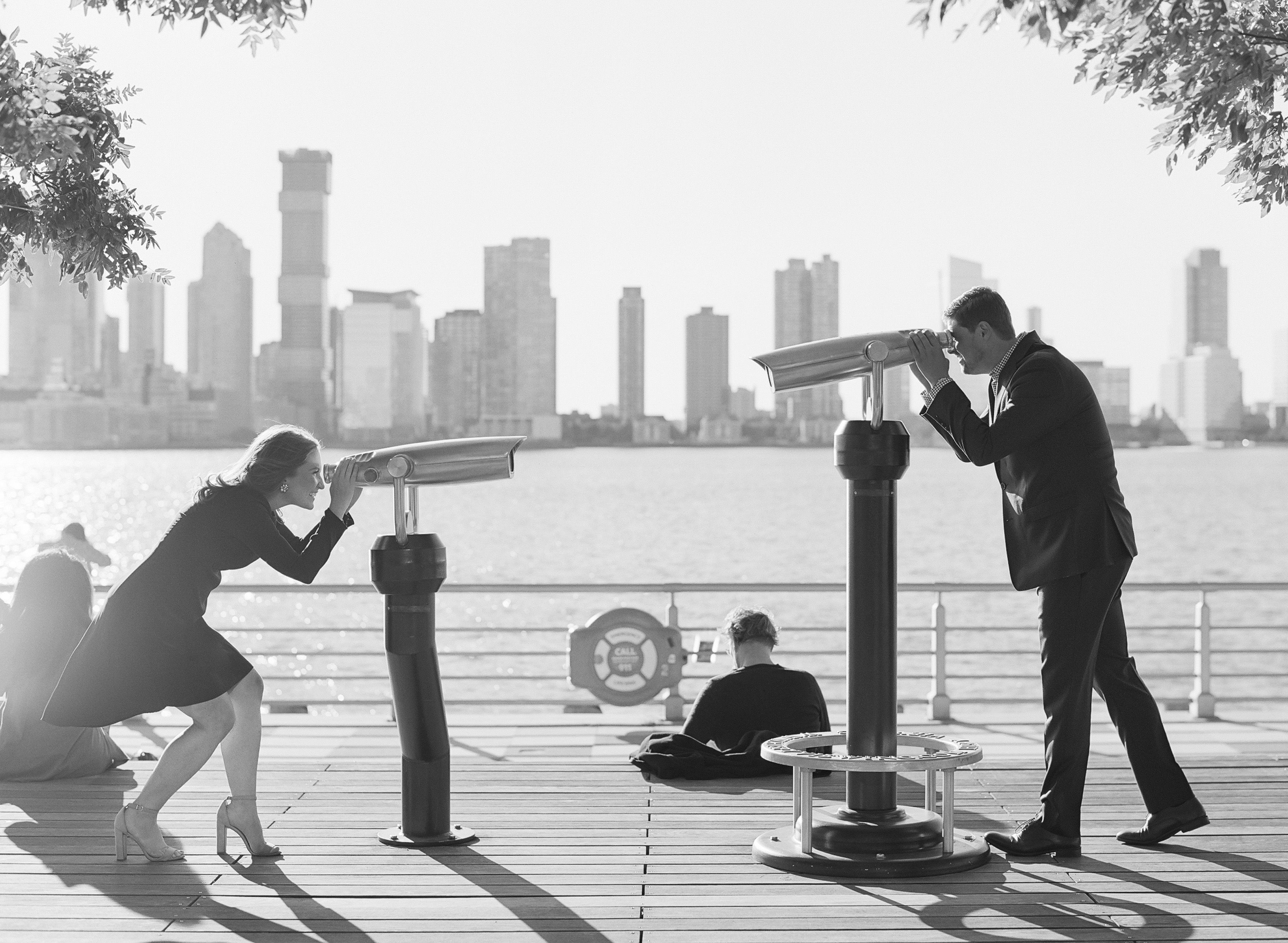 View Fine Art Portfolios Couple looking through telescopes at each other