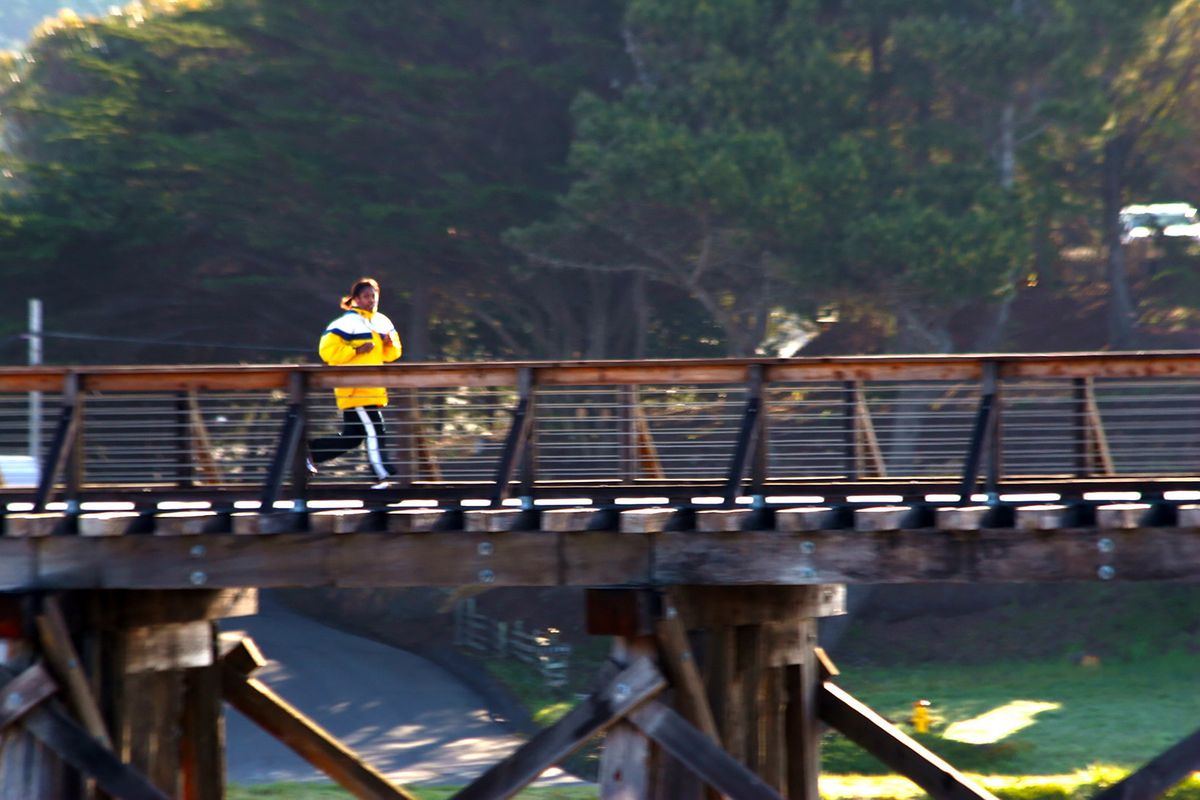 Lori Livebooks running on the bridge at Ft. Bragg, Cali Resized.jpg