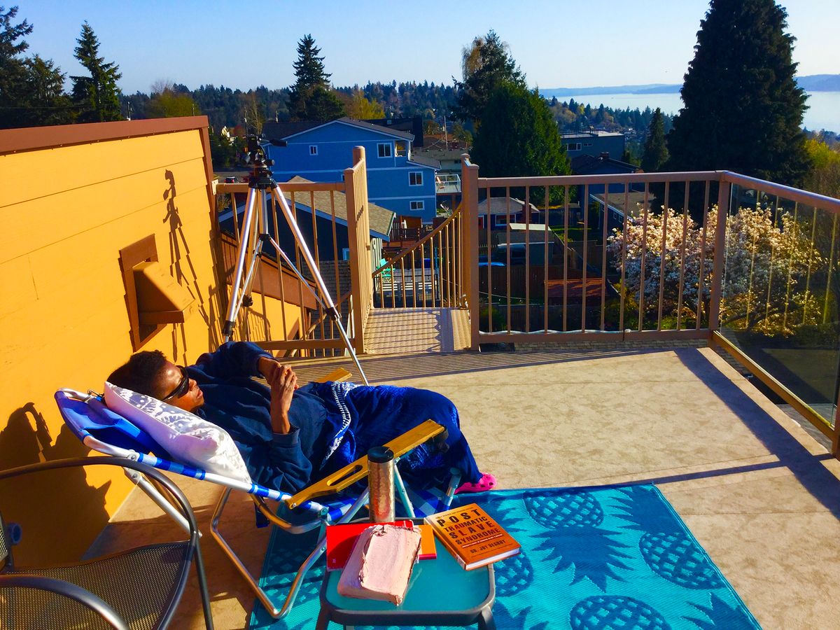 Lori sunning on the roof Deck.jpg