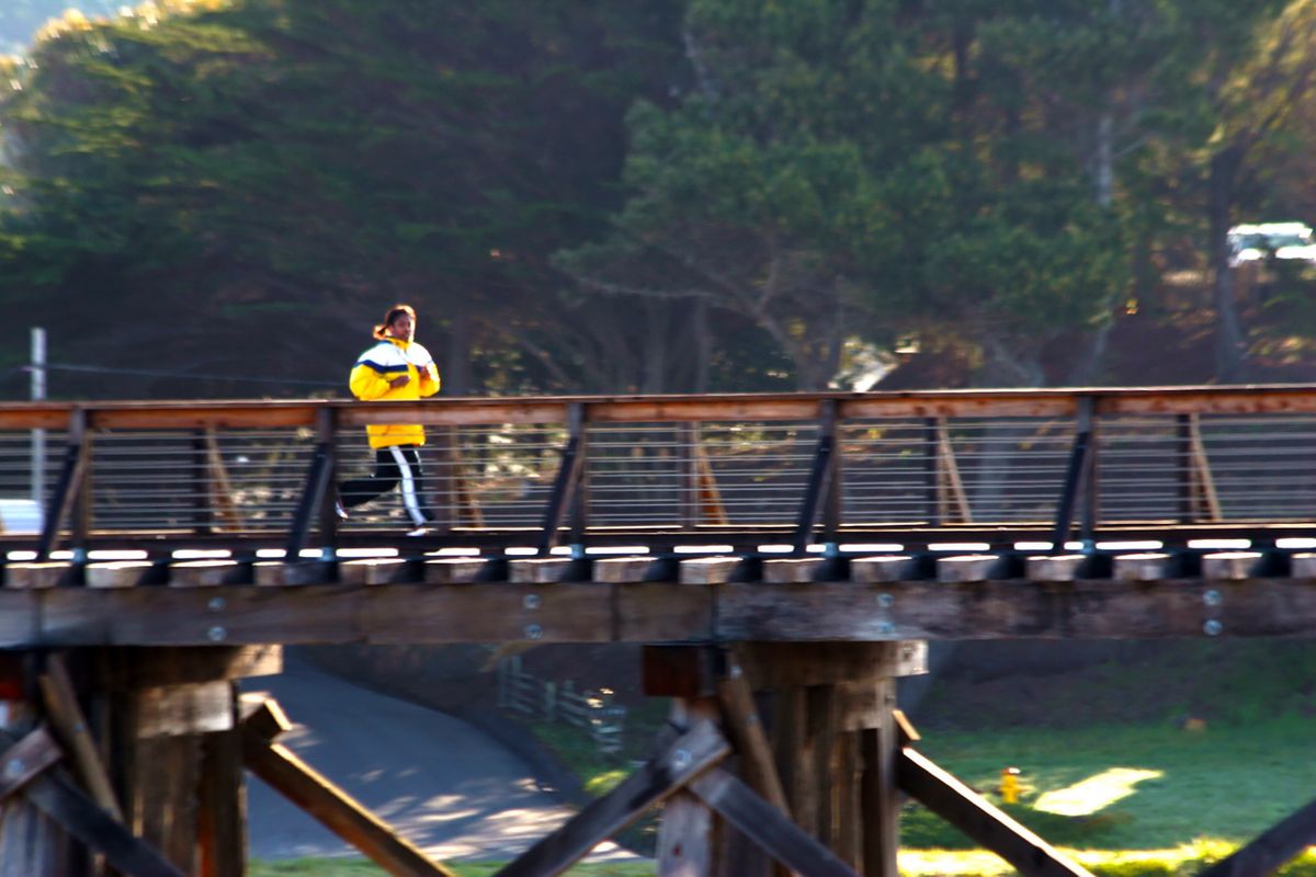 Lori Livebooks running on the bridge at Ft. Bragg, Cali.jpg