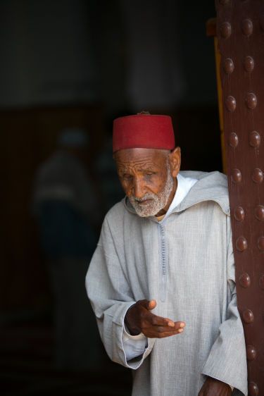 Blind Man Leaving Mosque in Rabat, Morocco