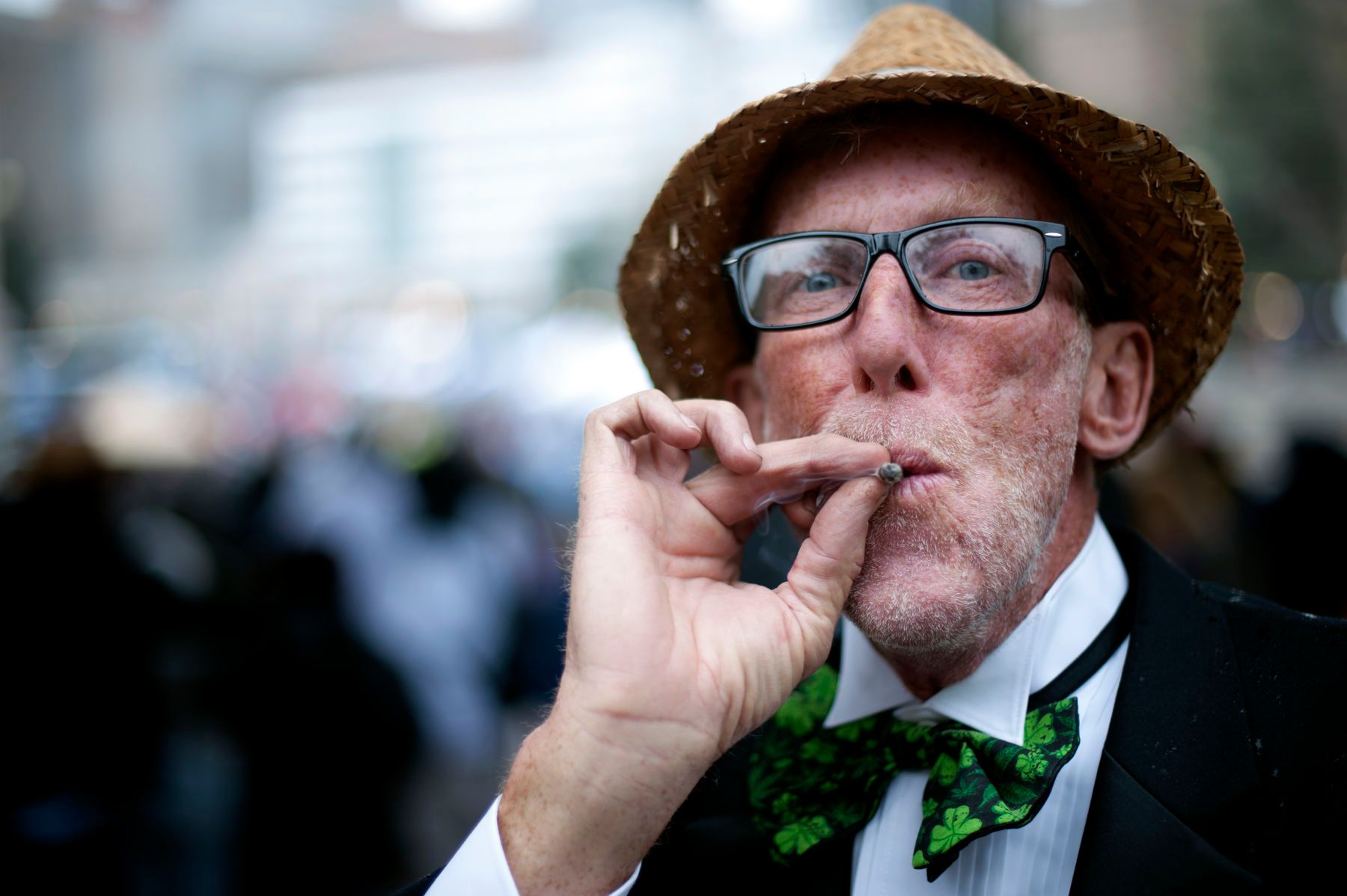 James Reed smokes a joint during the Denver 420 Rally at Civic Center Park in Denver, Colorado on April 20, 2017. The rally, held annually, is a celebration of both the legalization of cannabis and cannabis culture. Colorado is one of twenty-six U.S. states along with the District of Columbia that has legalized the use of cannabis either recreationally or medically. 1r420_r458ally_denver
