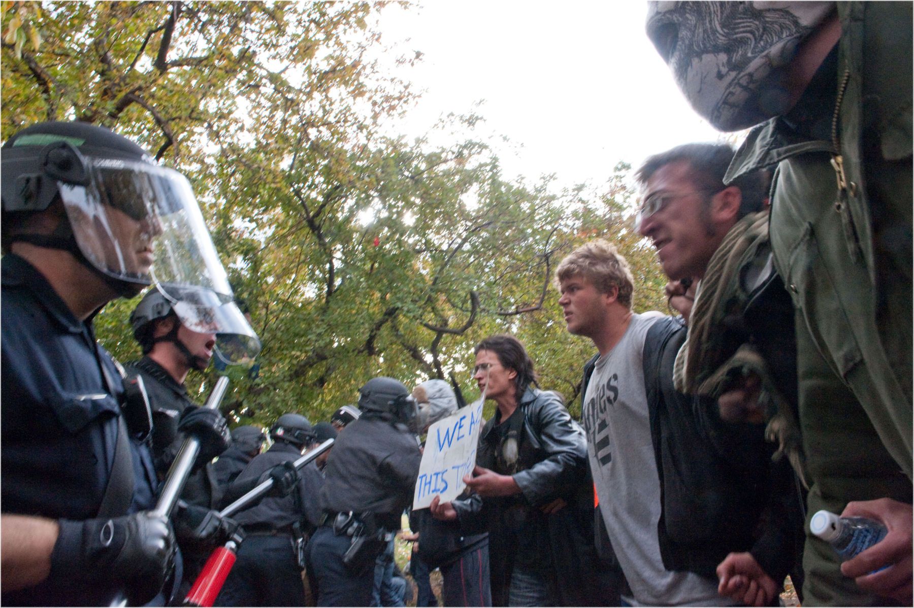 Demonstrators and Denver Police square off just before the police entered Civic Center Park to remove several tents. 1stareb