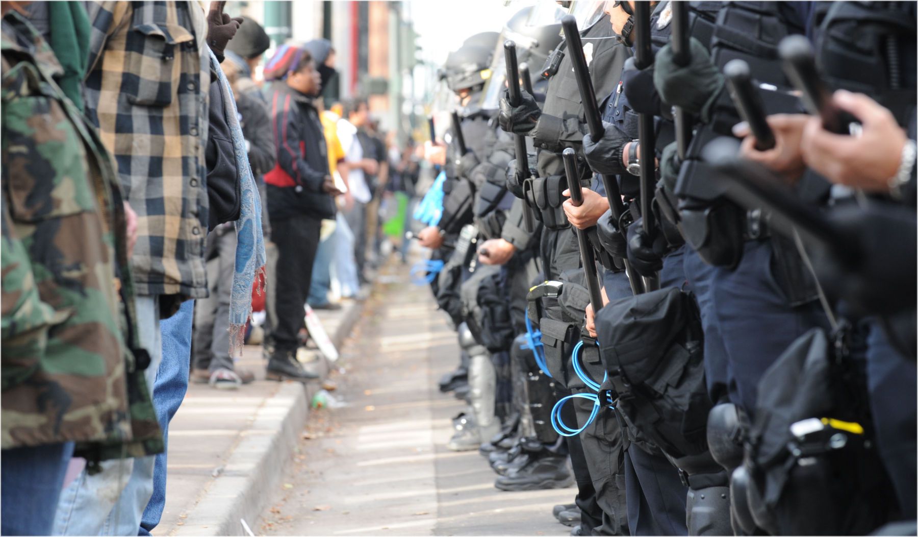 Demonstrators and Denver Police lined off against each other. The police closed down access to Broadway and the state Capitol. 1standoffb