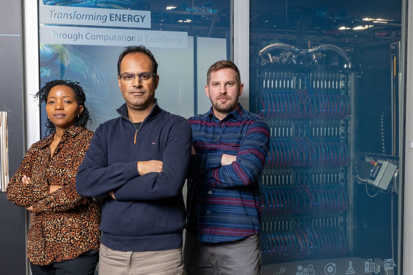 Data scientists in front of a Super Computer 