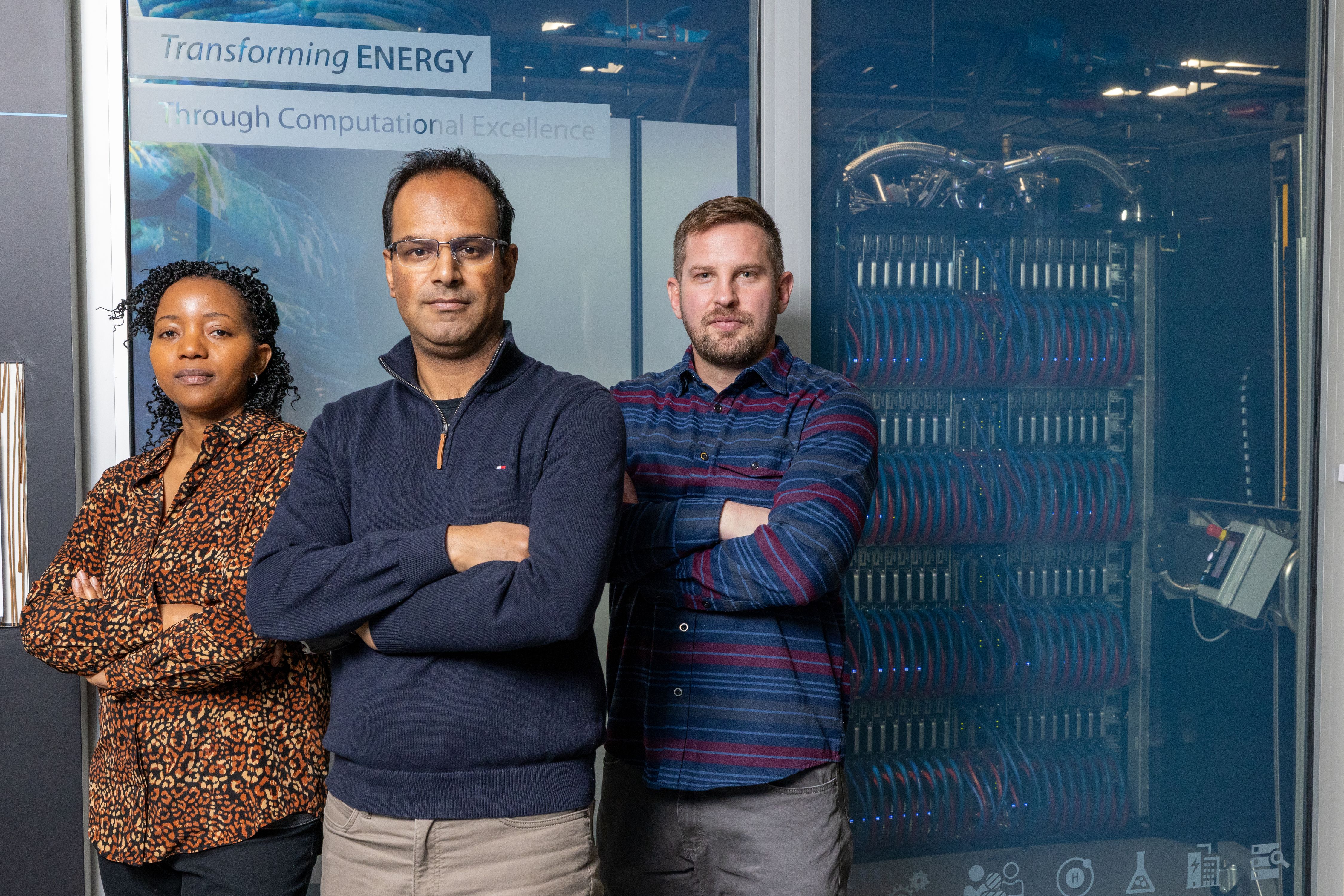Data scientists in front of a Super Computer 