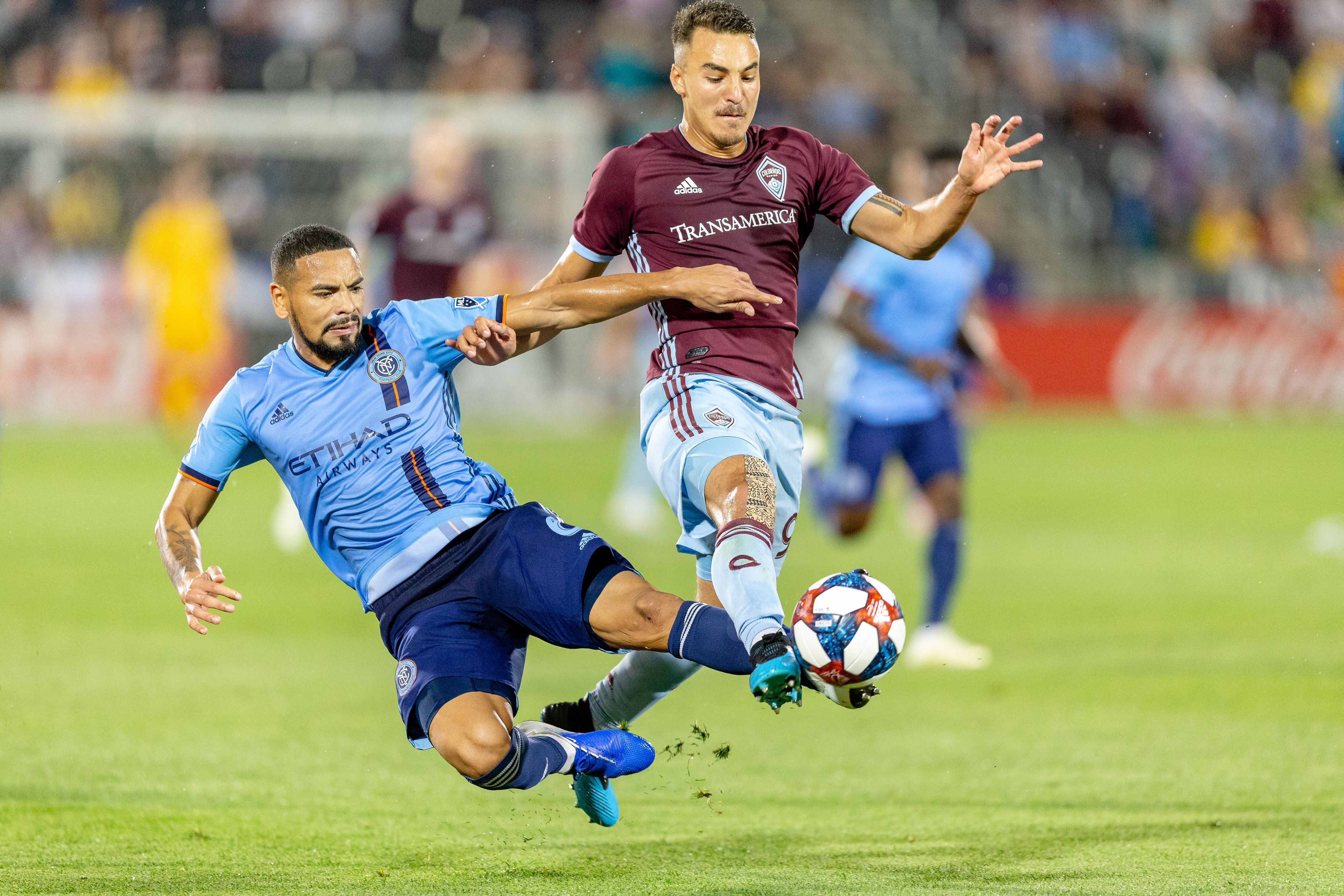 Soccer Players Reach for Control