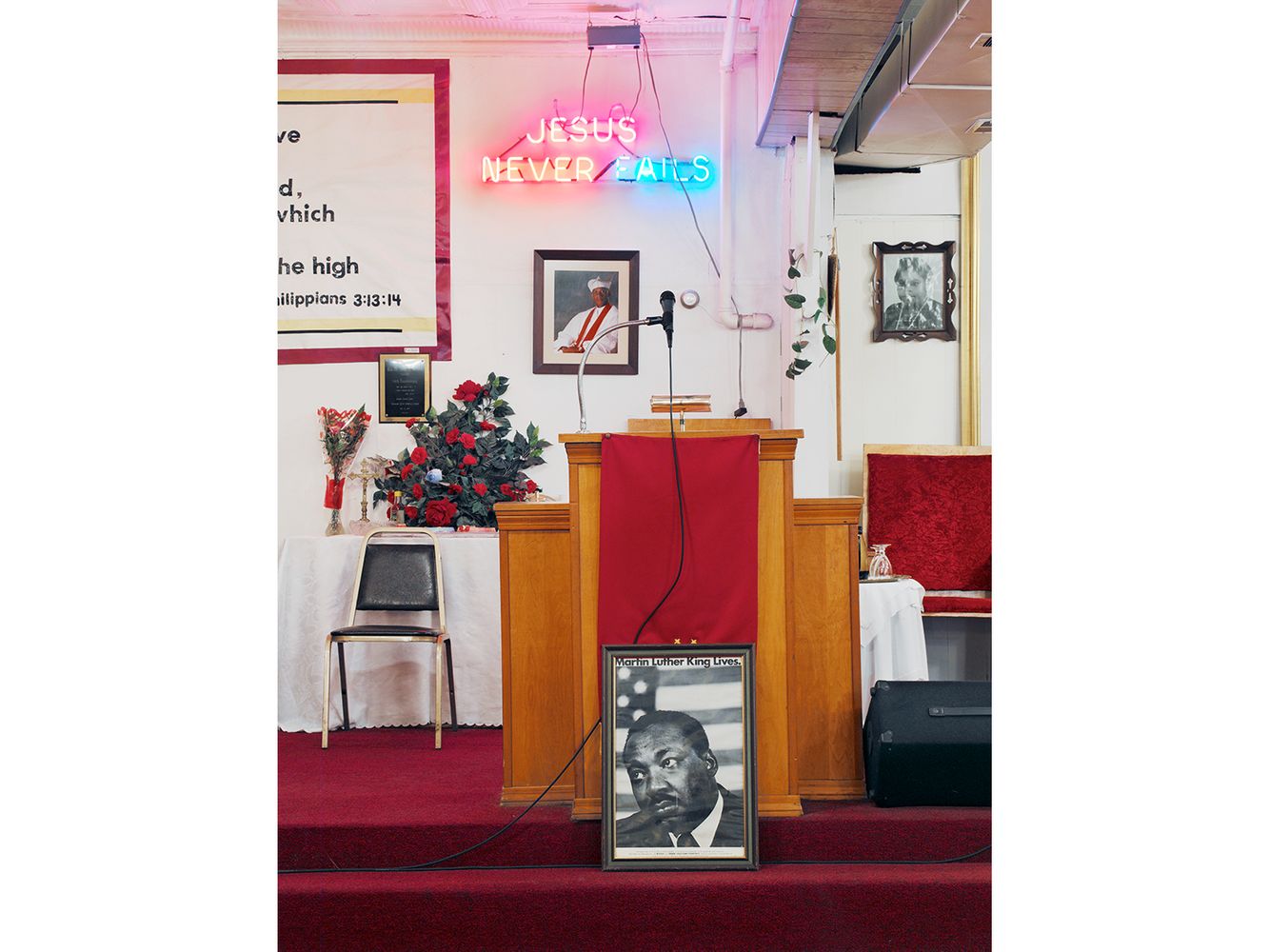A doubtful looking portrait of Martin Luther King sits in front of a pulpit. Pulpit, Traveler's Rest Spiritual Church, 7030 S. Racine, Chicago 2006