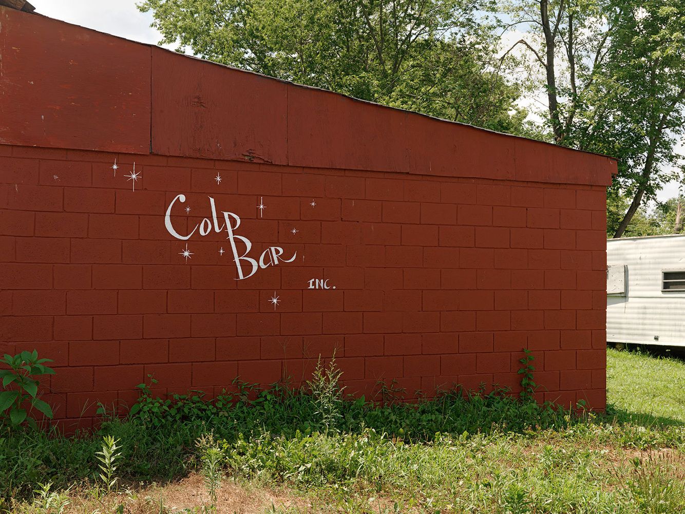 In the 1970's Colp Bar opened as a mixed-race tavern when the other local bar in town refused to serve blacks. Many well known black blues musicians performed here. Colp Bar closed down in 2007 due to the dwindling population of the town. Wall Graphics, Colp, IL 2009