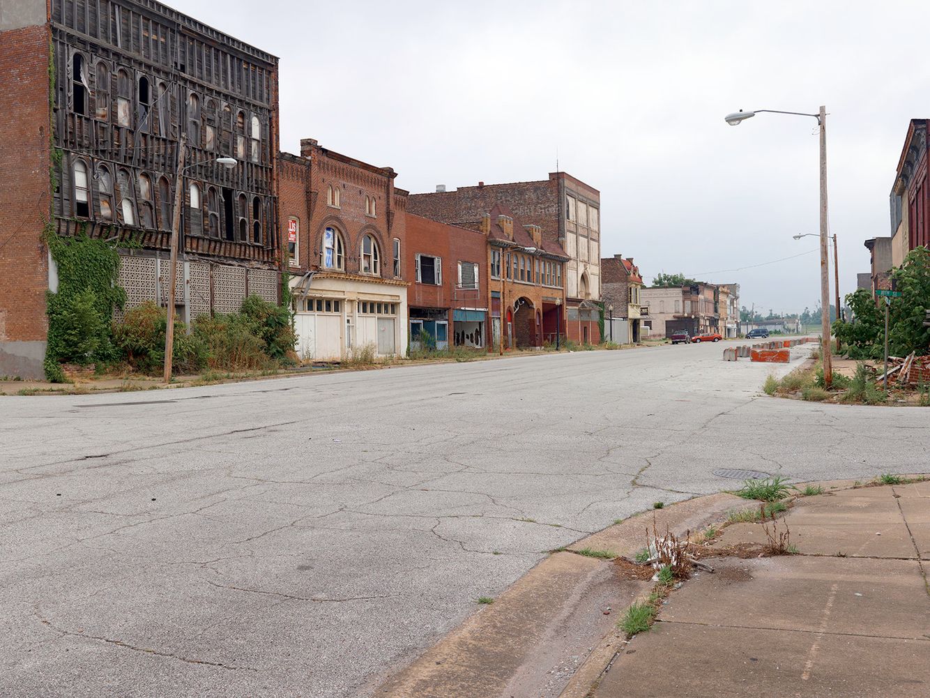 This block is the site of the 1909 lynching of Willie James, a black man accused of raping and killing a young white woman. His rope broke during the hanging, so the angry mob riddled his body with bullets, dragged him a mile to the scene of the crime, then set his body on fire. All of this took place in front of 10,000 cheering spectators, of whom many who participated in this horrific event were women. Commercial Ave. now sits vacant, the victim of a civil rights boycott that lasted three years during the early 70's as blacks refused to shop in the stores where shop owners wouldn't hire them, eventually driving the white business owners out of business. The city never recovered economically after that event. In its heyday during the 1920's Cairo's population peaked around 15,000. Recent census figures report only 2,800 residents, 60% of which are black living at or below poverty level. Commerical Avenue, Historic Downtown Cairo, IL 2009.