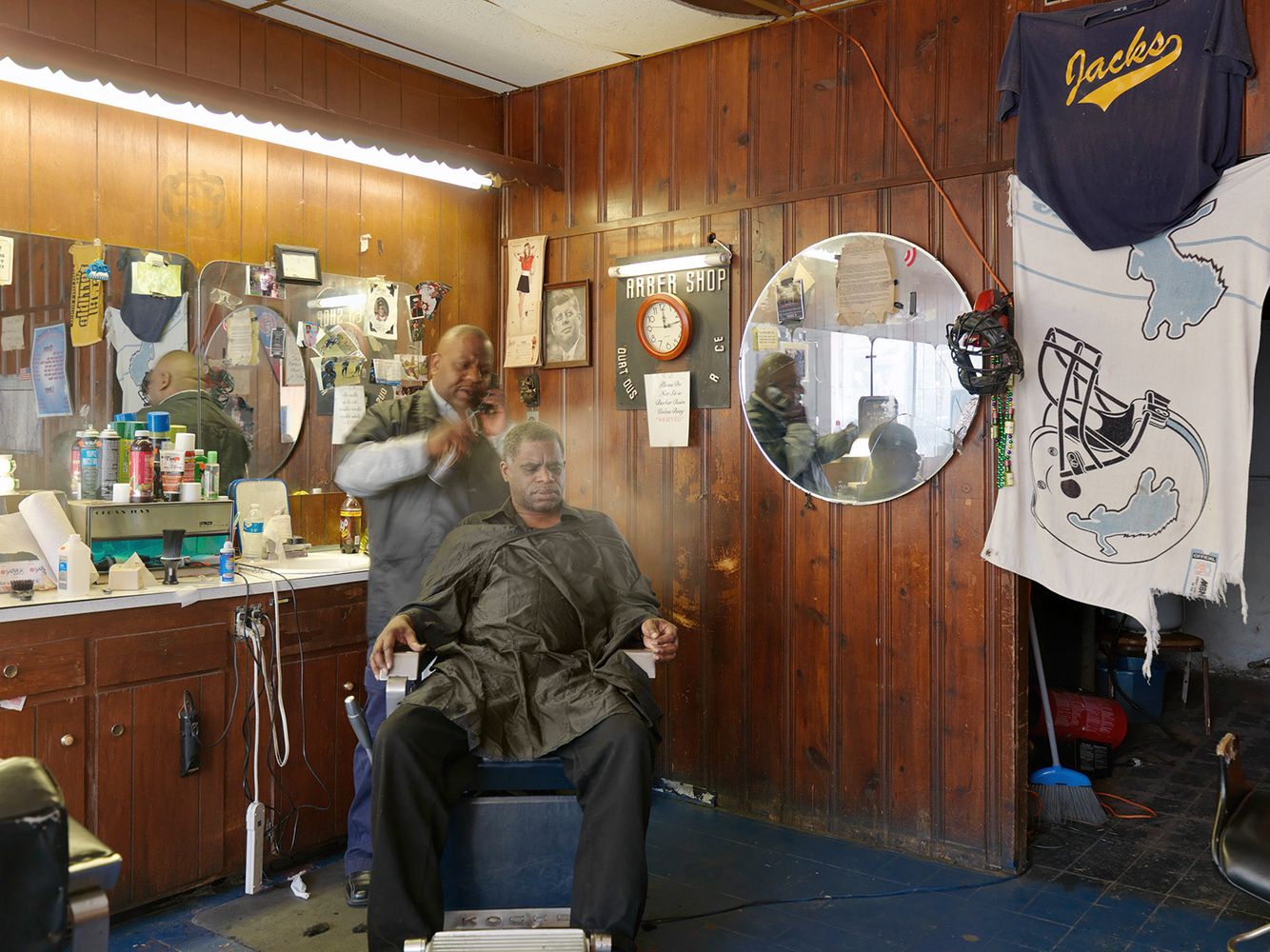 Mr. Jackson (Jack) tending to a customer, Jack's Barber Shop, East Canfield St., Detroit 2011