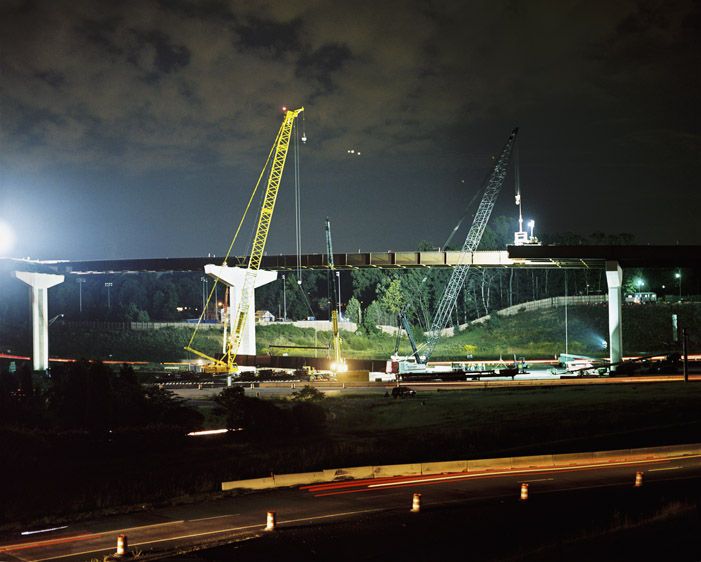 Setting high steel bridge beams at night at the Mixing Bowl/Springfield Interchange