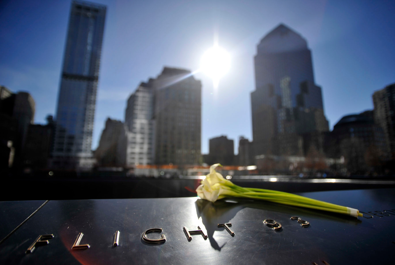 A flower is placed at the World Trade Center memorial in New York City.