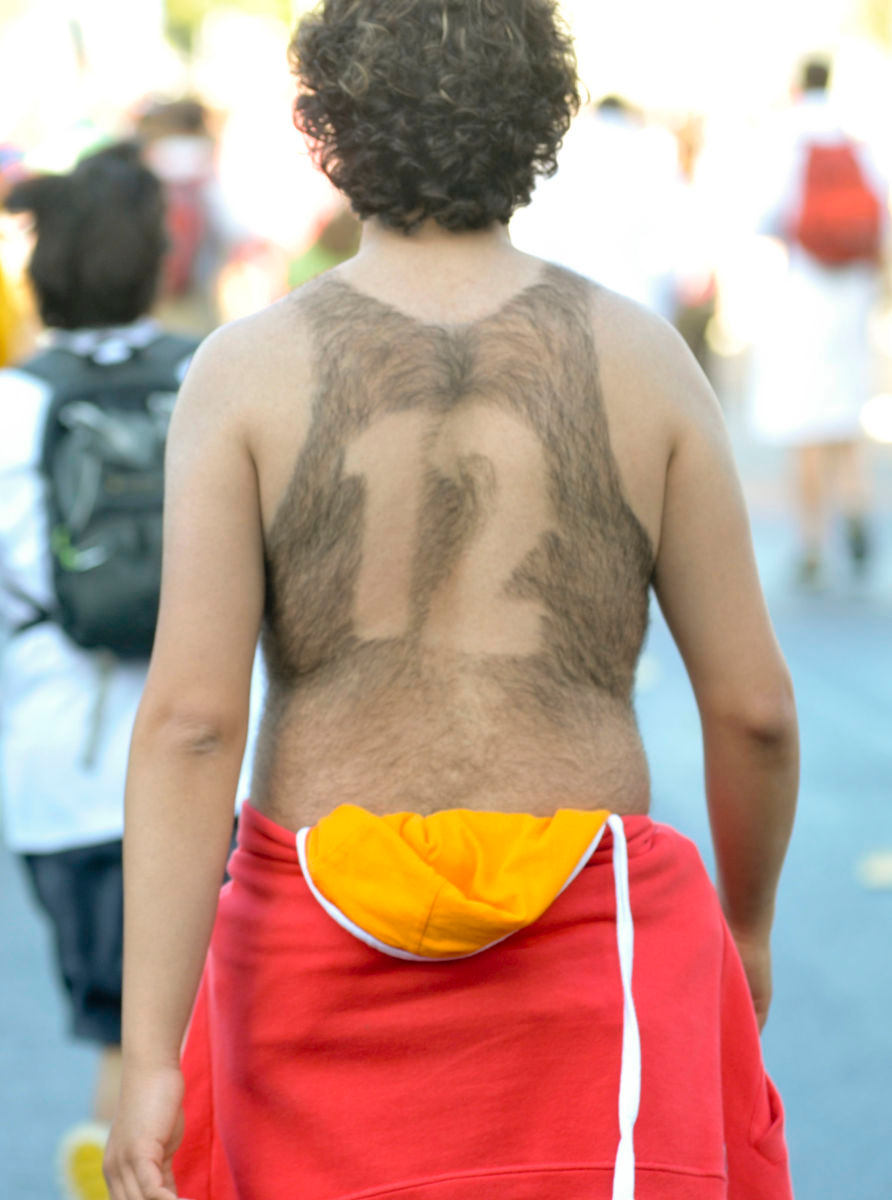 MARATHON: A number is shaved into a man's back during Bay to Breakers