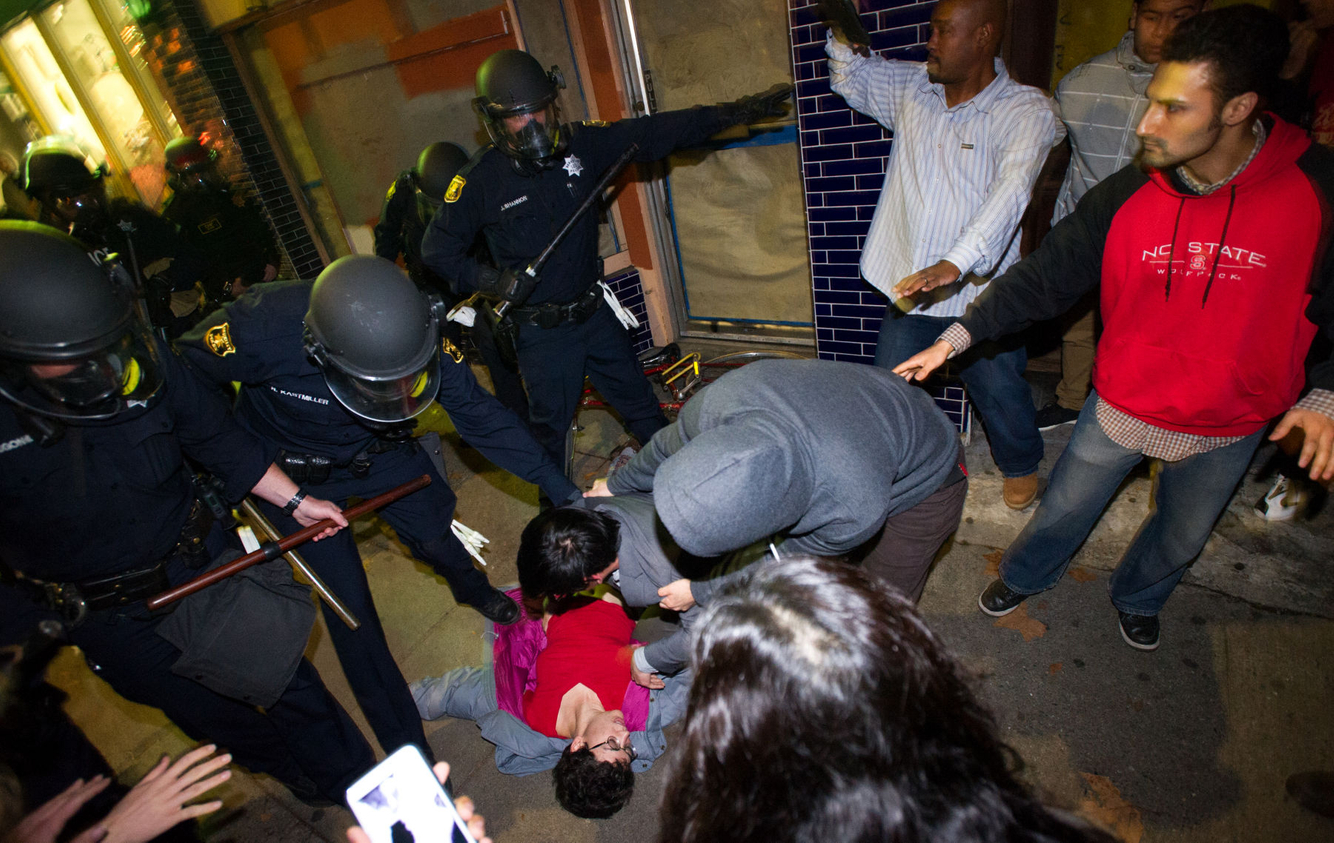 PROTESTS: Police and protesters react as a woman has a seizure during anti-police brutality demonstrations in Berkeley, California.