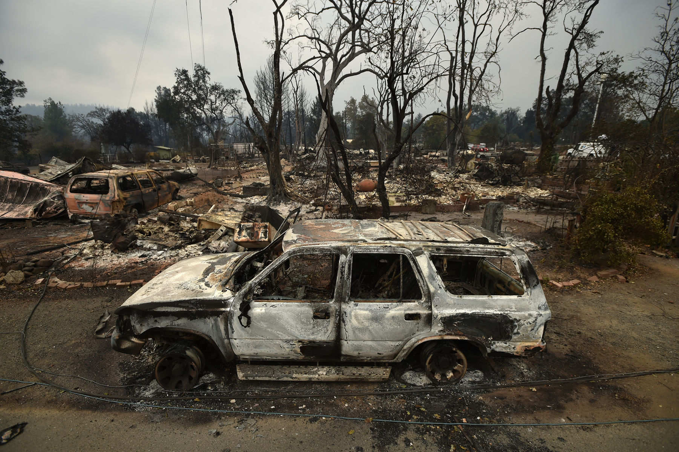Burned out vehicles and homes are seen in a residential neighborhood of Middletown, California after the Valley fire tore through the area.