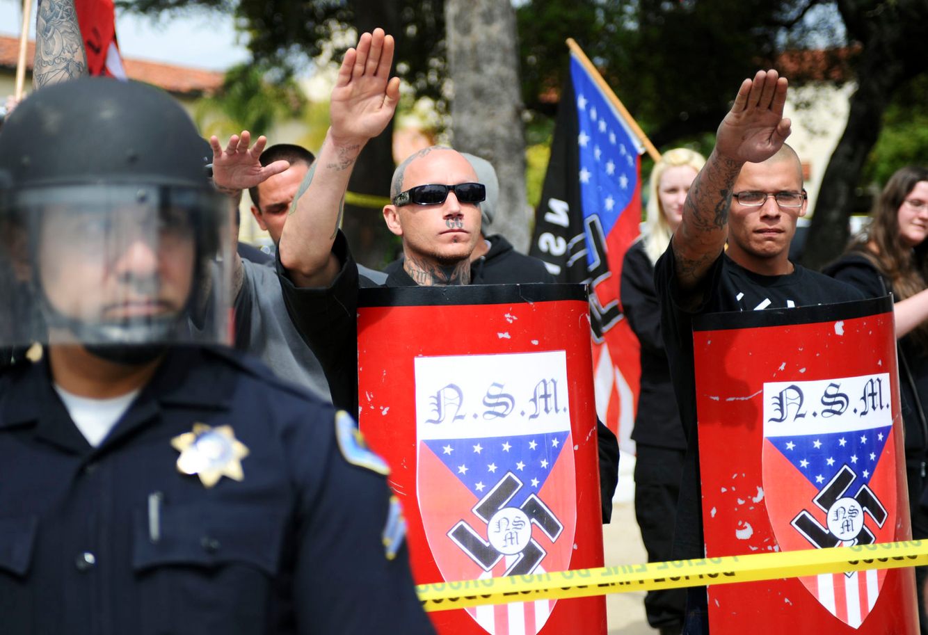 NAZI RALLY: Pro-Nazi supporters salute at a National Socialist Movement rally in Claremont, California