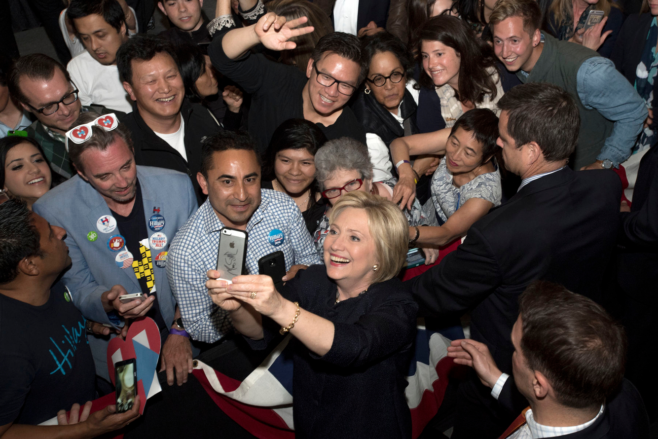Hillary Clinton takes a selfie during a campaign event.