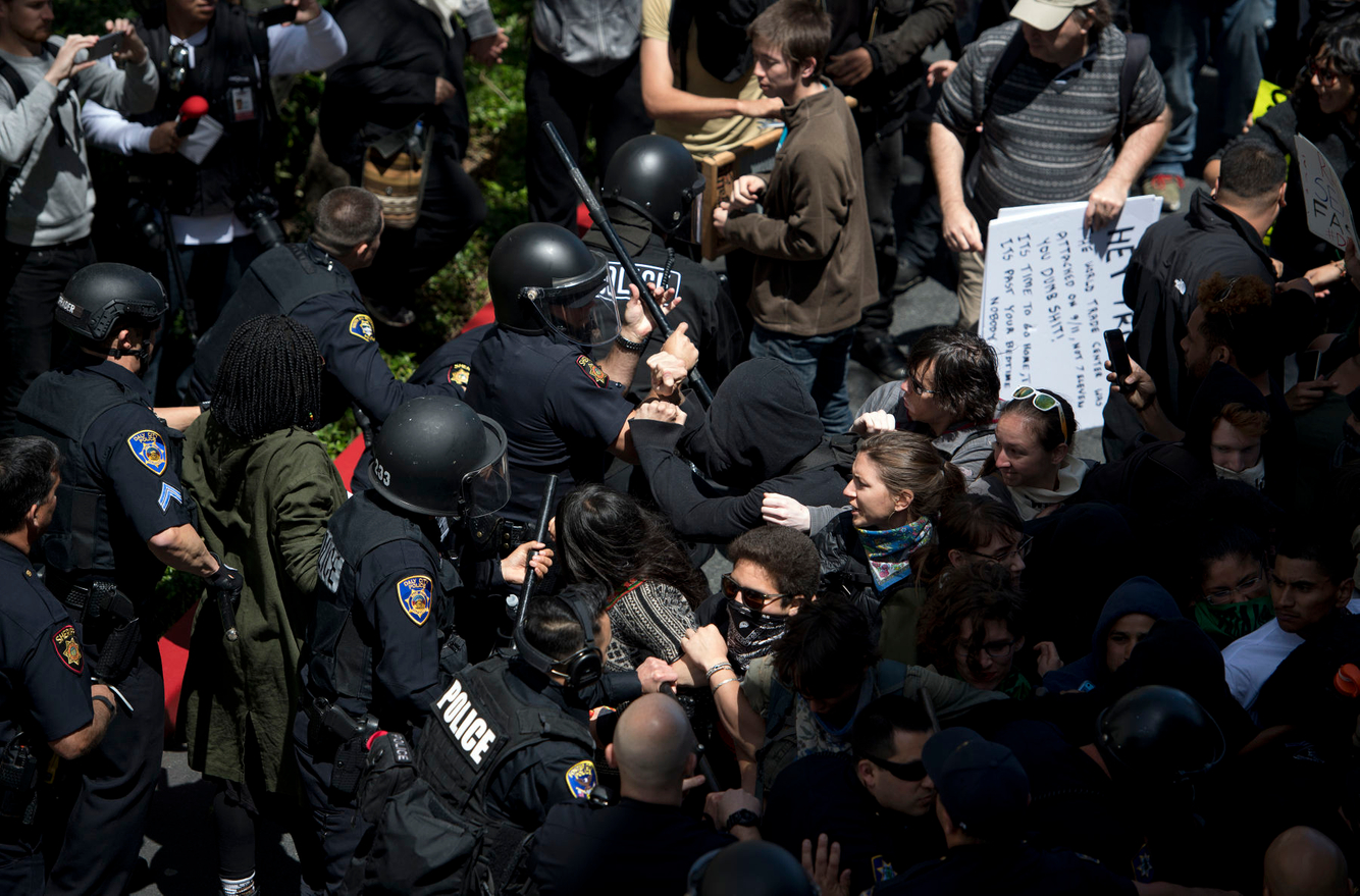 Anti-Trump protesters scuffle with police in San Francisco.