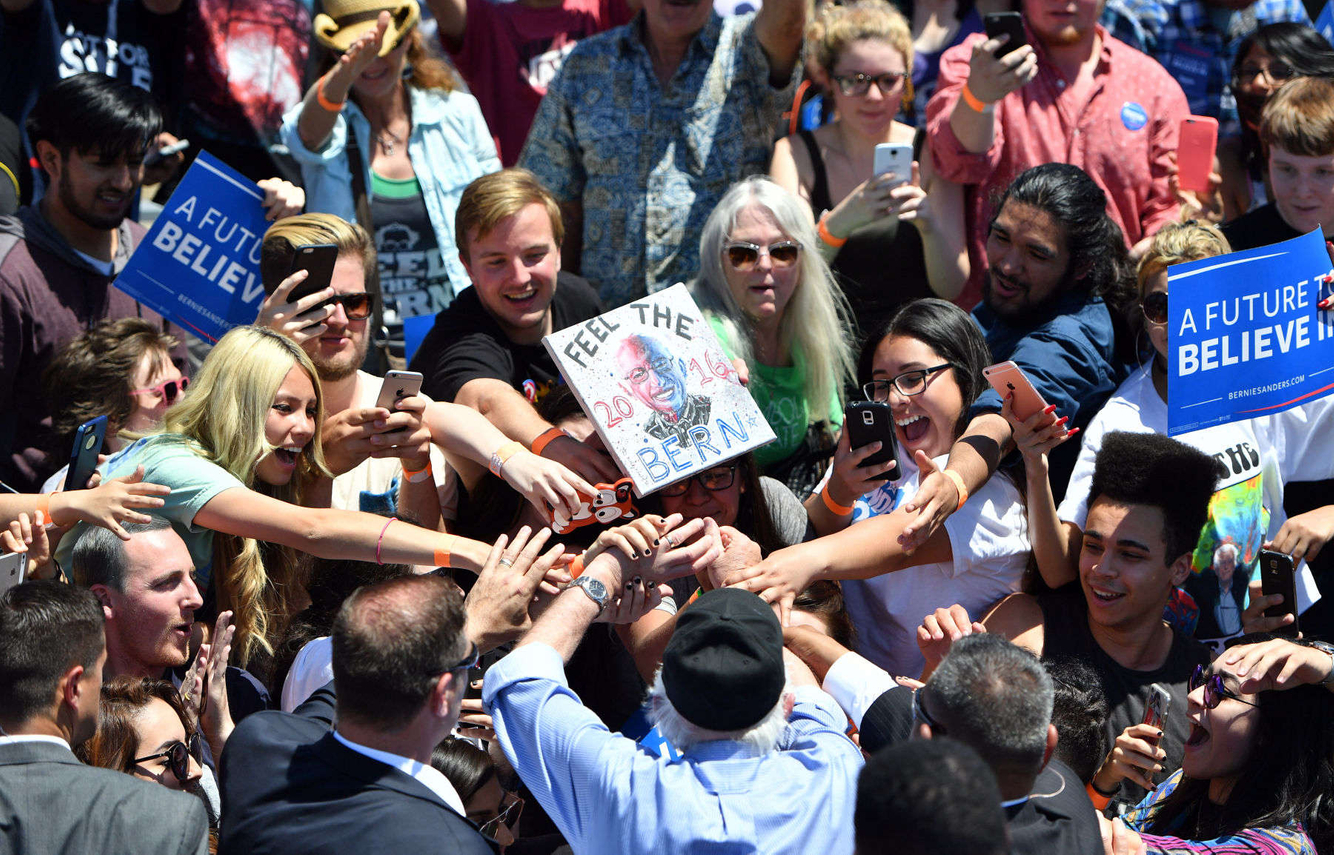 Supporters surround Bernie Sanders during a campaign event.