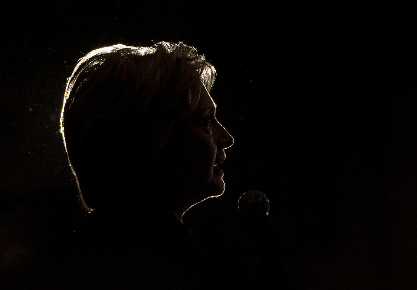 Hillary Clinton is silhouetted during a campaign event in Las Vegas.