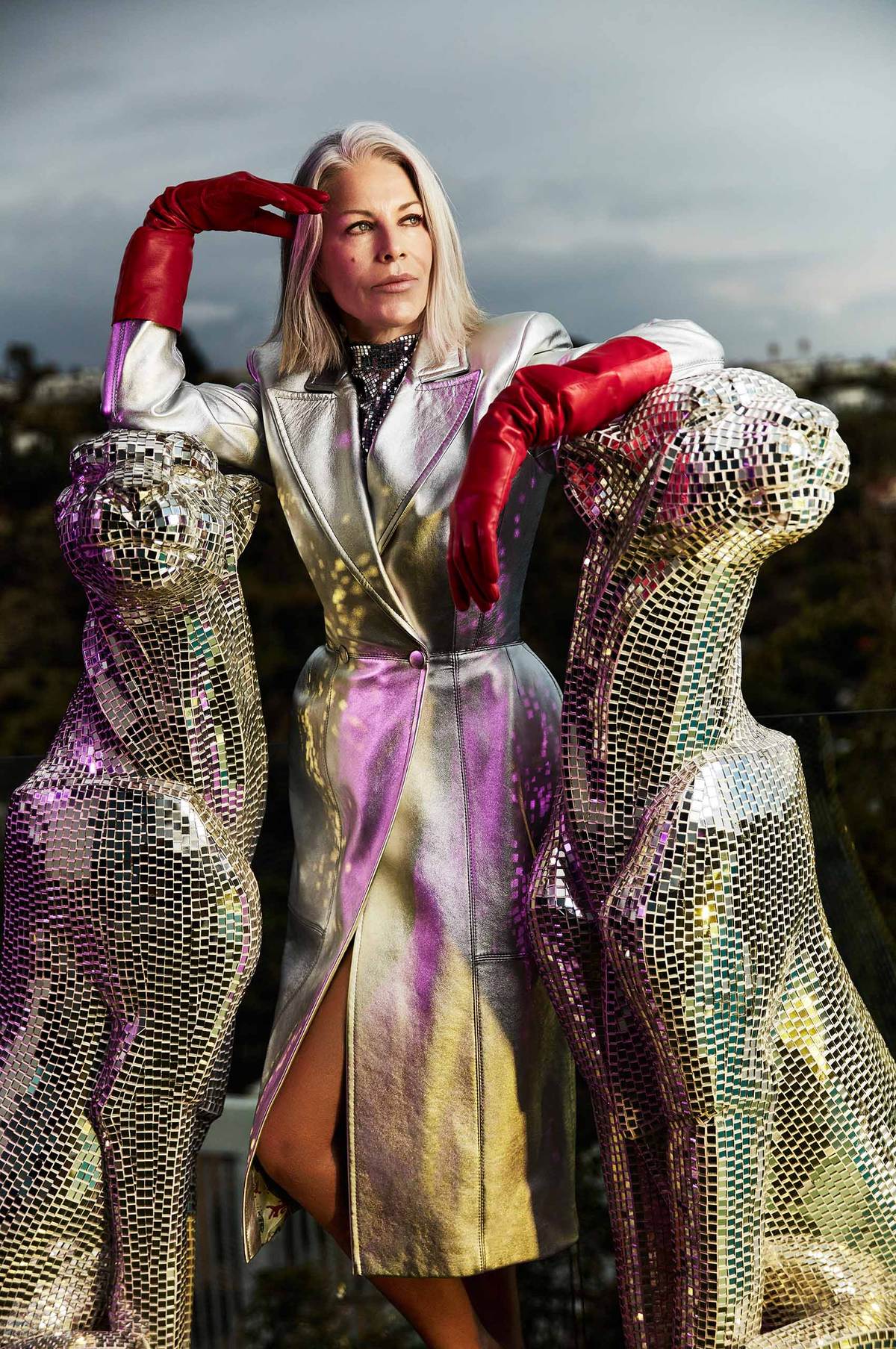 WOMAN wearing a silver coat and red long leather gloves standing between 2 mirrored  jaguarsVicky_Original_Runway-007_v2.jpg