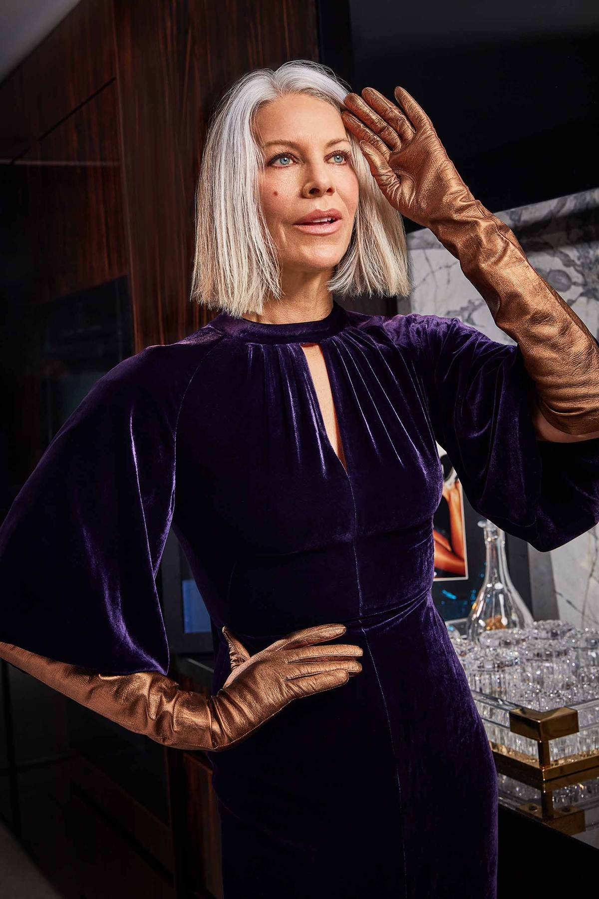 MATURE woman with silver hair modeling in bronze colored leather gloves for the Seymoure Gloves campaign 2024