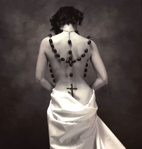 Woman with Large Crucifix Â© Ellen Denuto