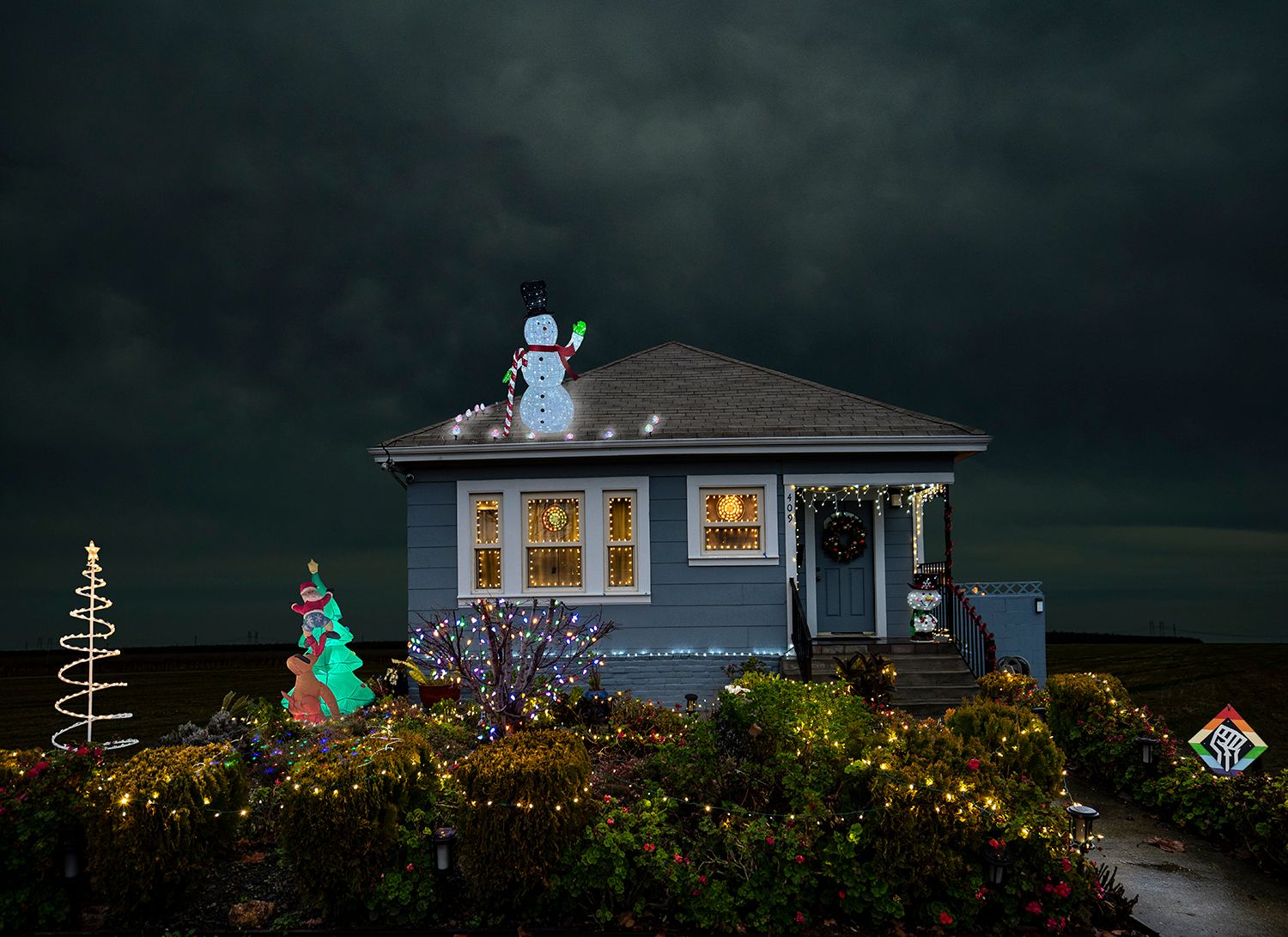 Archival Pigment print on photo rag paper from the Virtually No Place Like Home (for the Holidays) series Snowman and Fist House