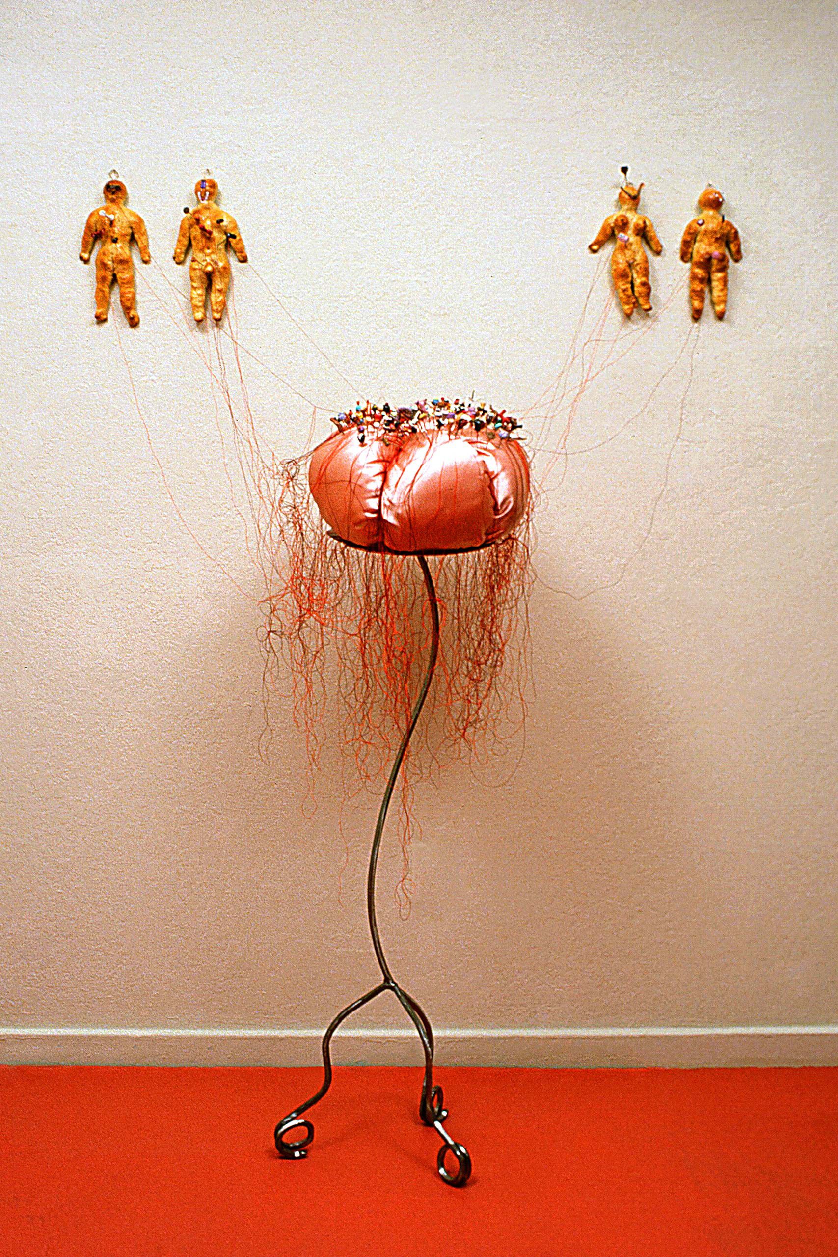 wall and floor mounted sculpture of bread, fabric, polymer clay, steel and thread giant pin cushion with tiny food pins and bread dolls