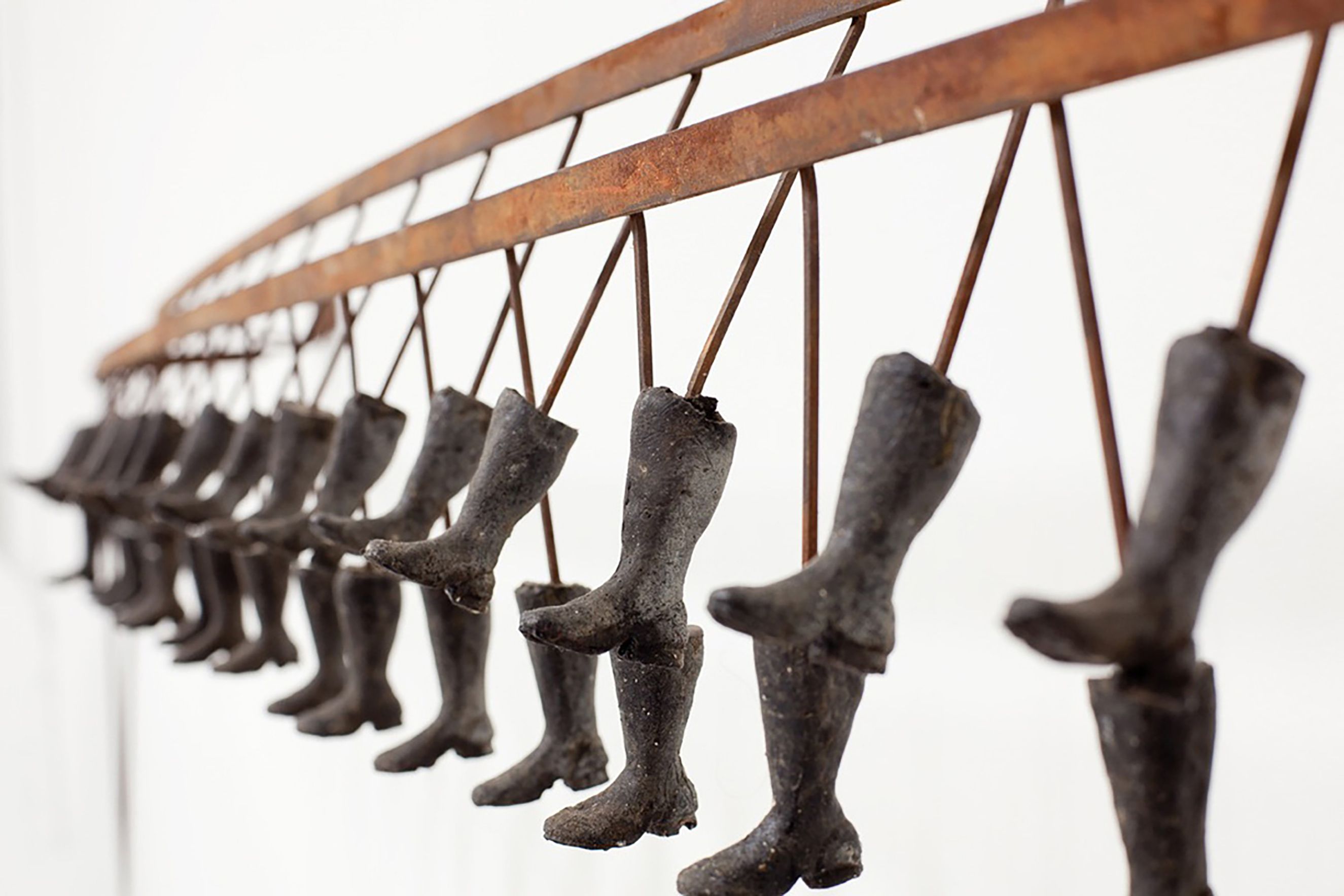 moving motorized steel and resin wall mounted sculpture Boot Machine