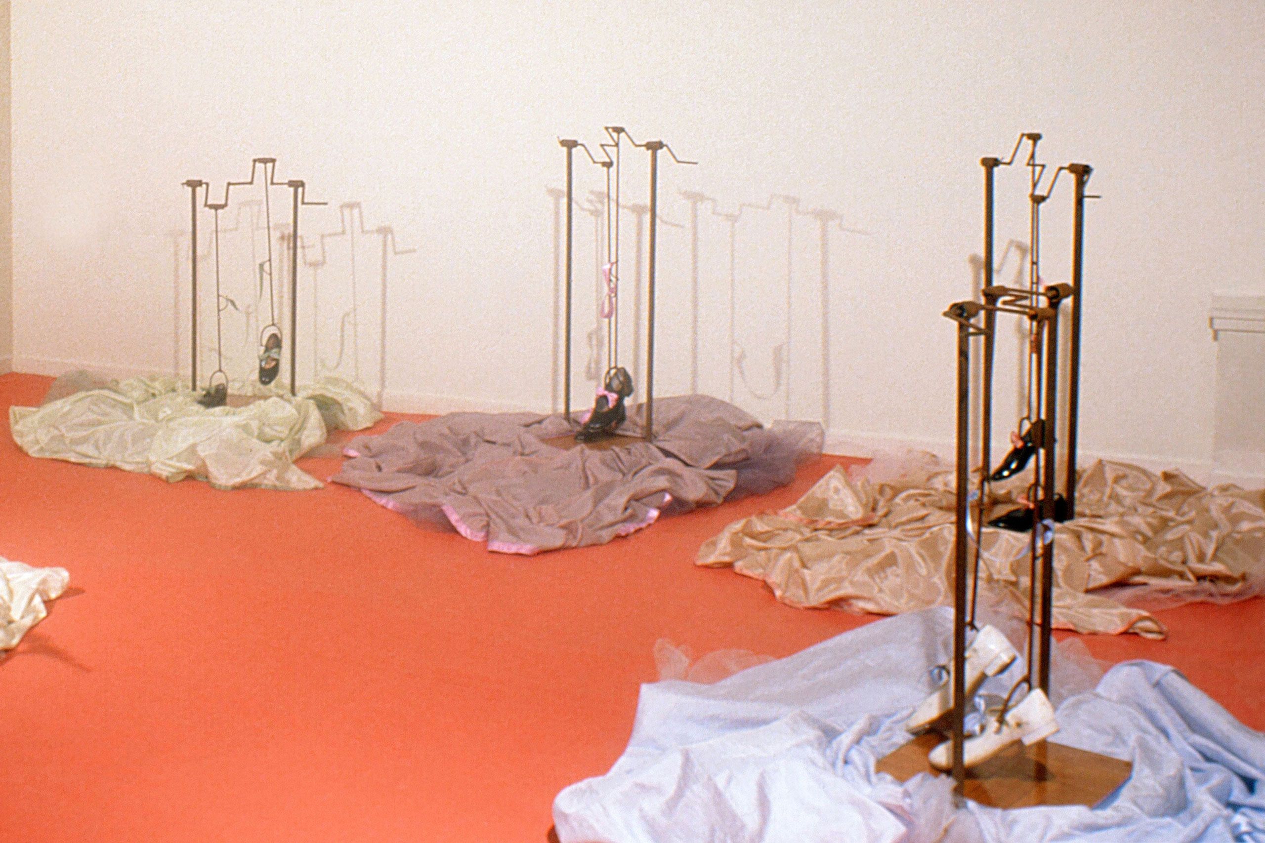 hand crank operated moving sculpture of steel, resin, fabric, wood and small tap shoes Shoe Machine